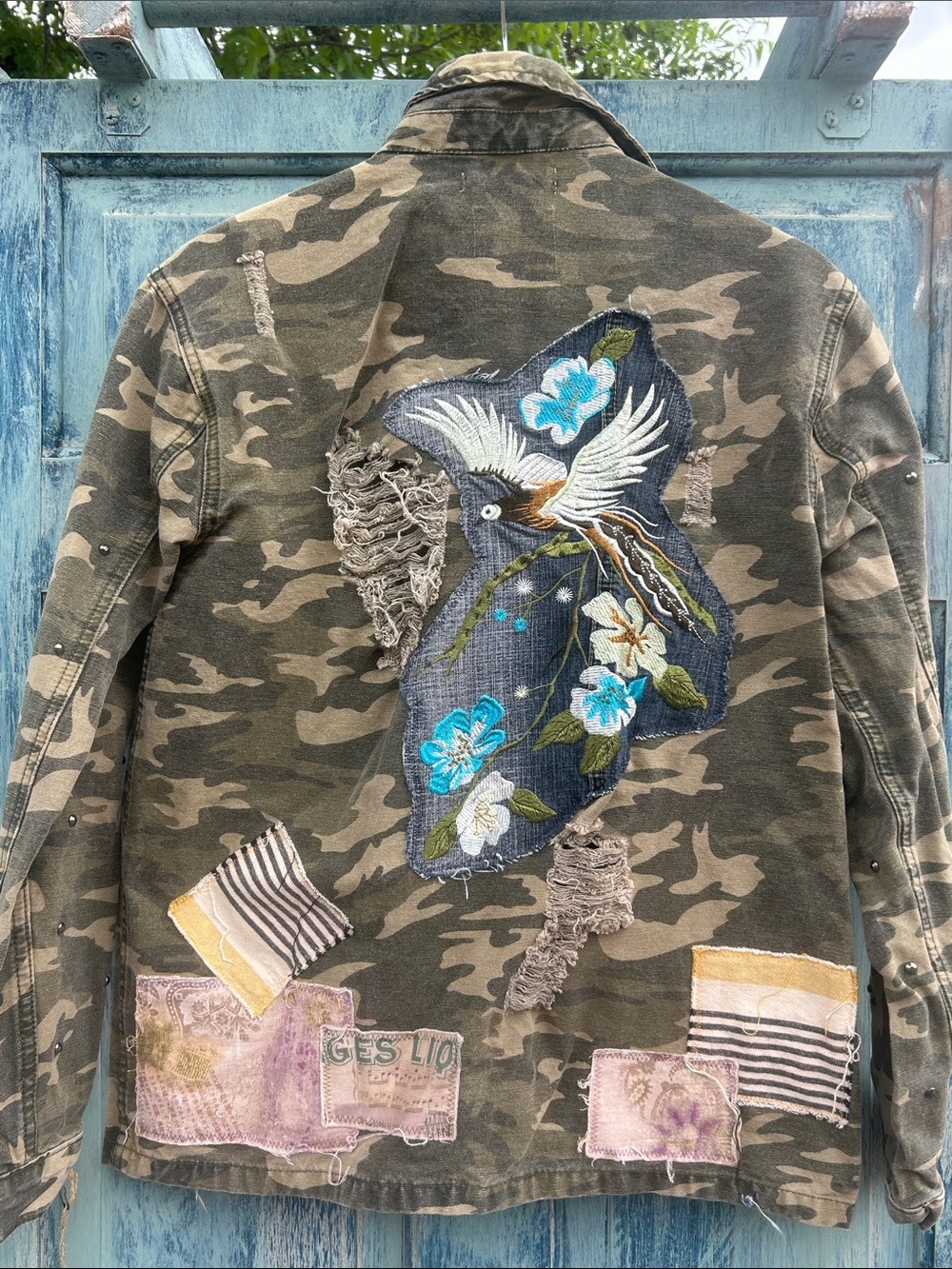 Upcycled embroidered flower & bird patched studded gilded intent camo jacket